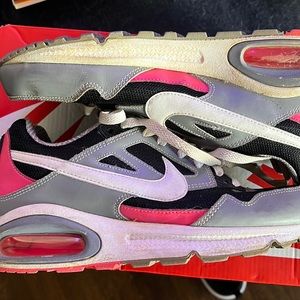 Hot pink and black Nikes